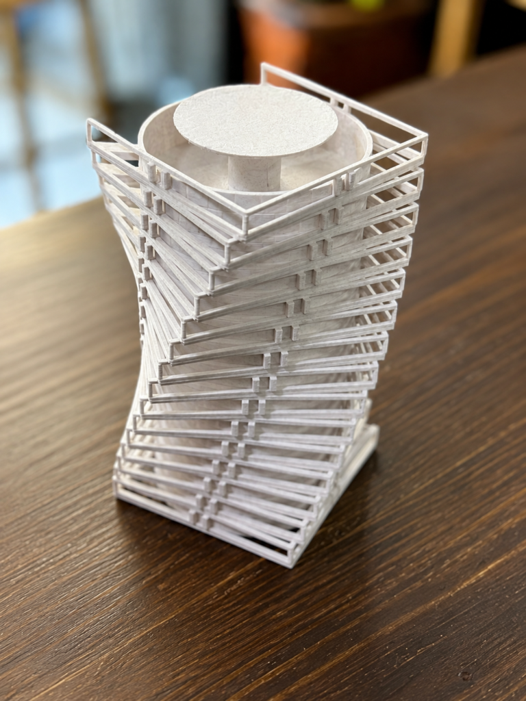 White twisting-tower architectural model with horizontal floor plates.