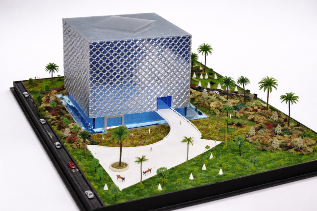 Architectural presentation model with patterned facade and landscaped site
