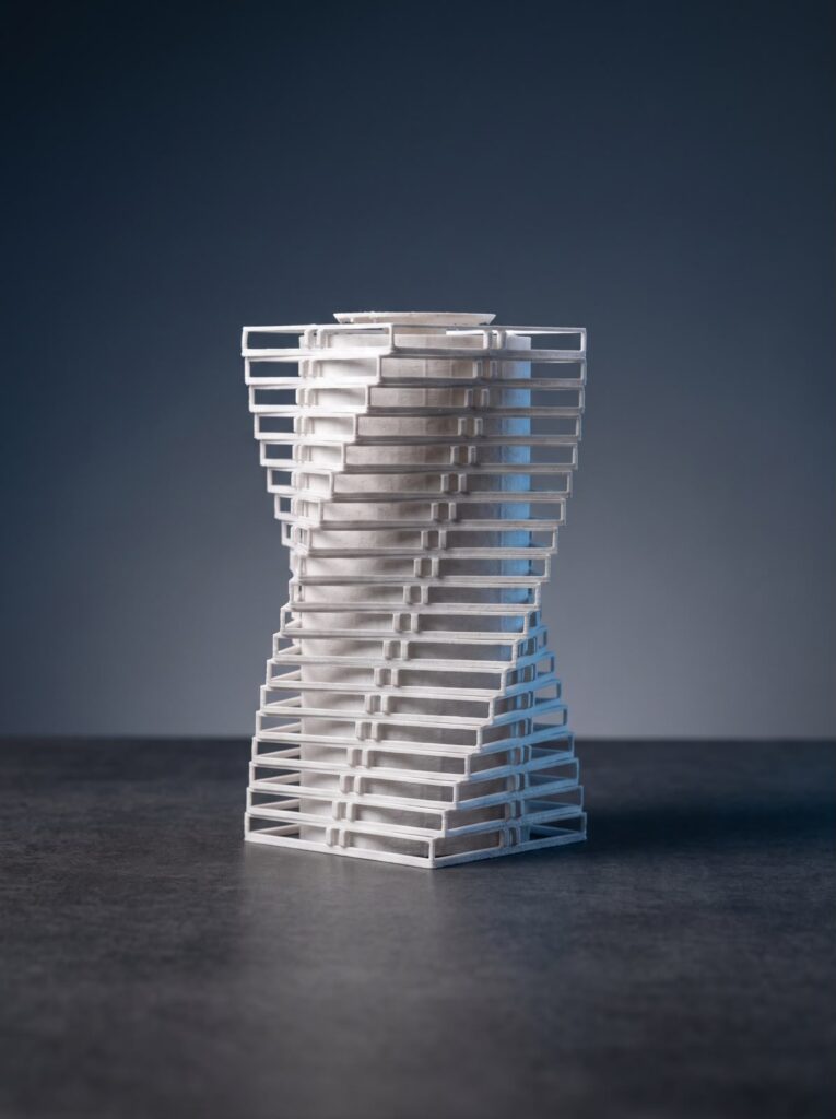 White 3D-printed high-rise architectural massing model