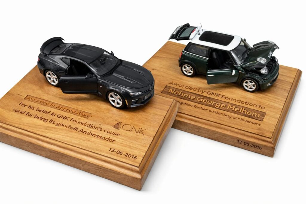 Engraved wooden vehicle display awards with miniature cars