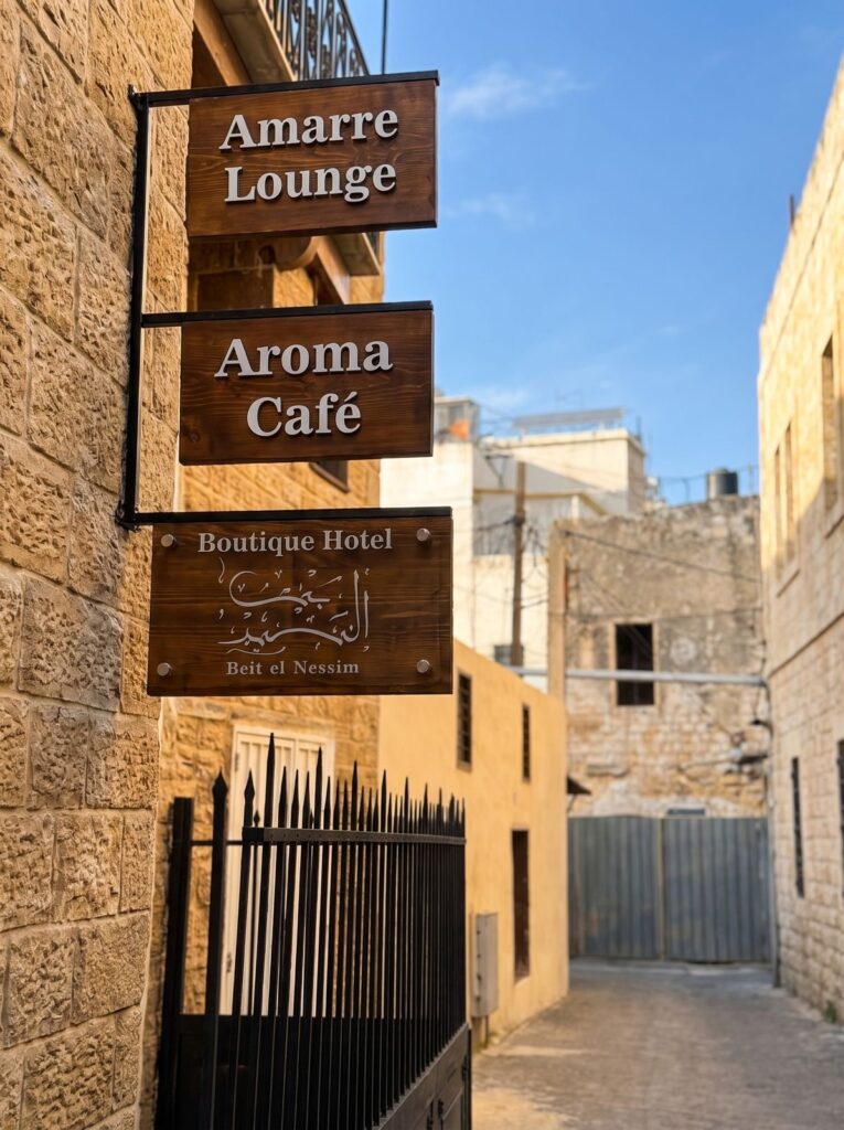 Hanging directional signs for a lounge, cafe and boutique hotel.