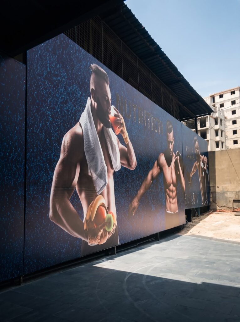 Outdoor wall branding produced for Gym Factory in Tripoli by SHARK.