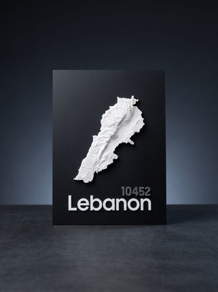 White relief map of Lebanon on a black presentation plaque.
